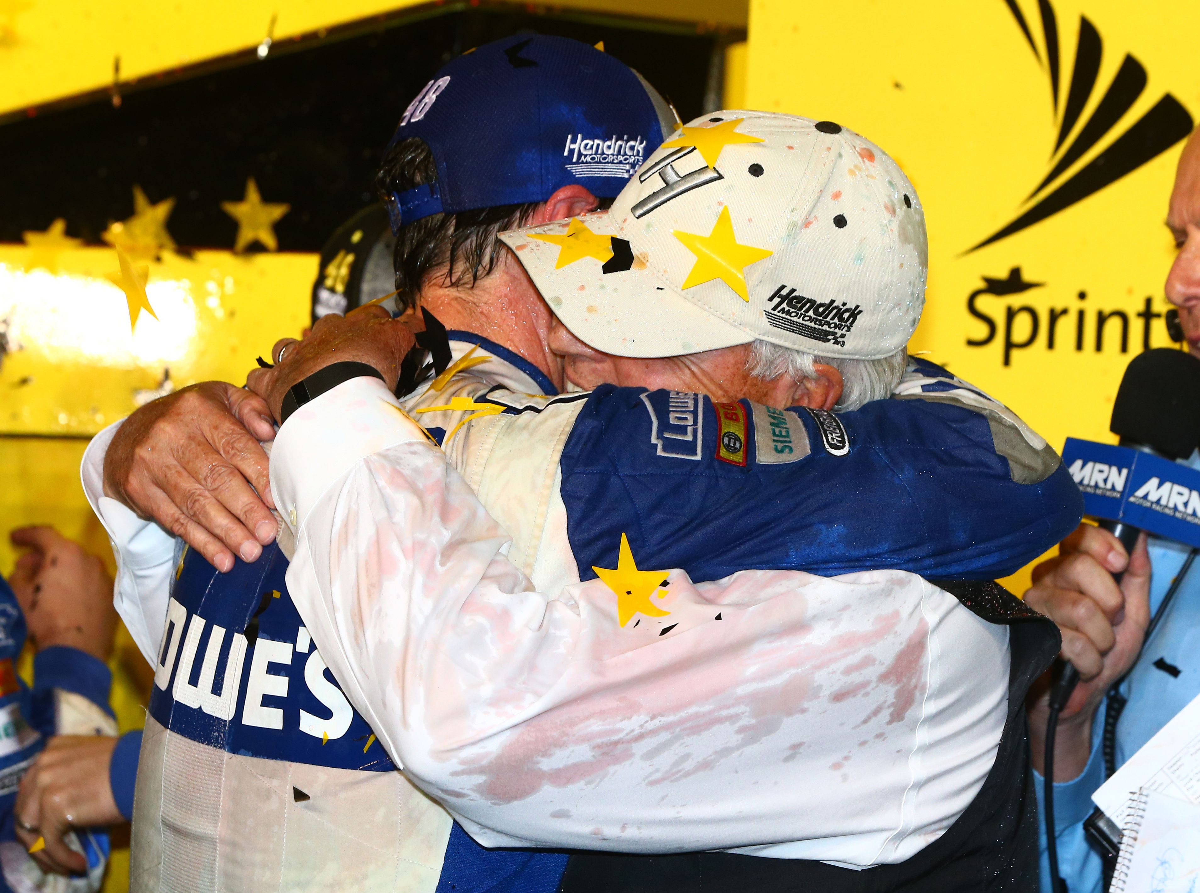 Jimmie Johnson (L) hugs team owner Rick Hendrick after winning his seventh championship. Source: Imagn
